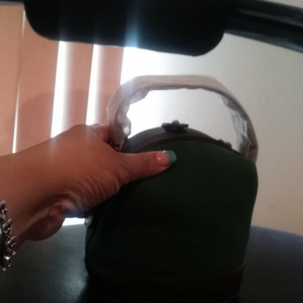 Mini hand holding bucket bag